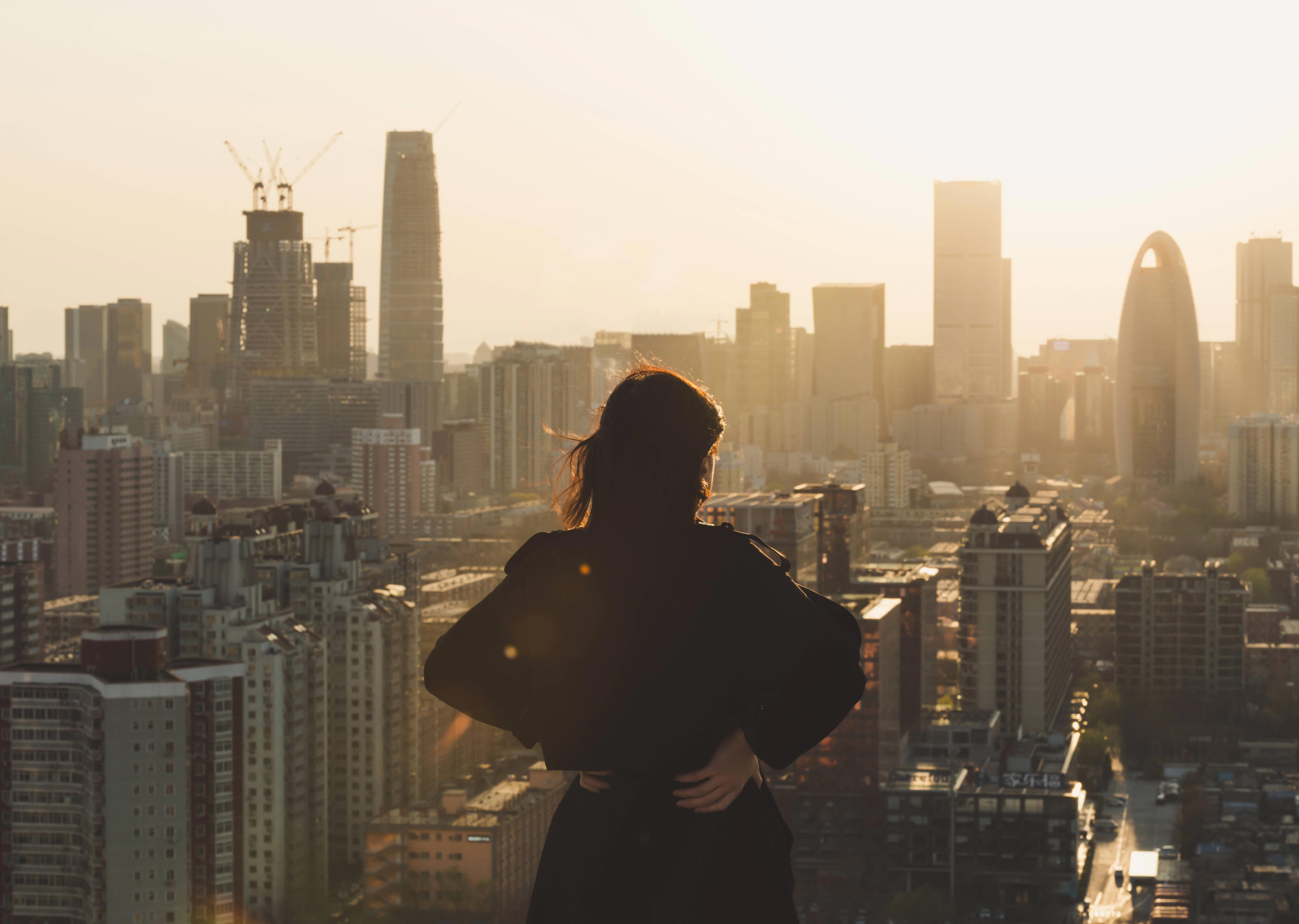 women looking at rooftops